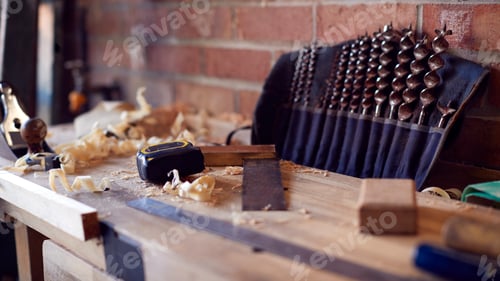 Preview: Close Up Of Wood Shavings And Carpentry Tools On Workbench