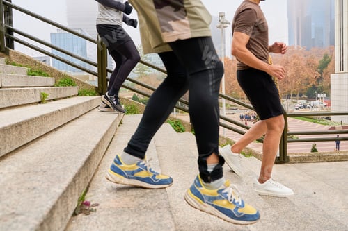 Preview: Athletes running up stairs in urban environment