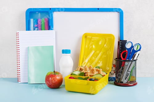 Preview: Kids lunch box with zucchini waffles, cucumber, cherry tomatoes and blueberries.