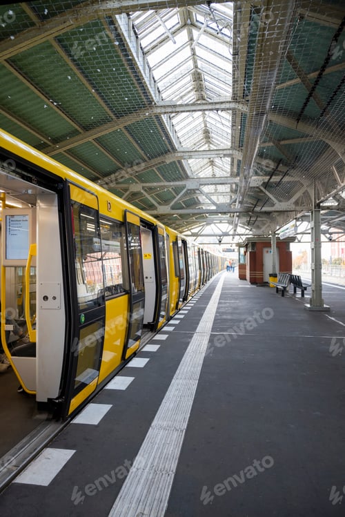 Preview: transport subway train train yellow cars at the railway station In Berlin Germany