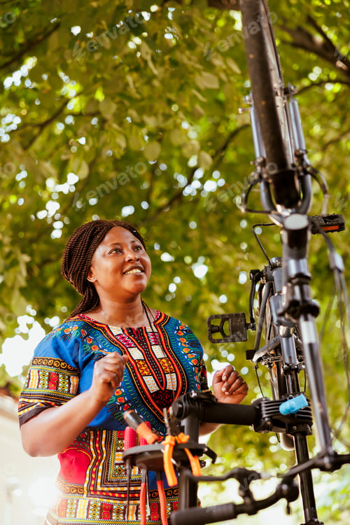 Preview: Woman conducting bike maintenance