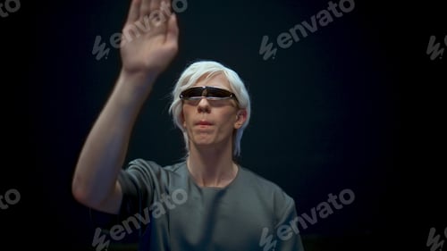 Preview: Vr guy immersing metaverse closeup. Futuristic player experiencing augmented