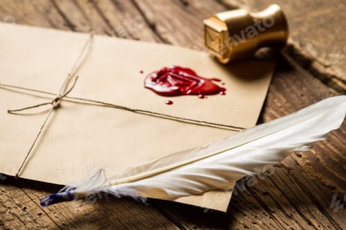 Preview: Closeup of feather on envelope with red sealant and metal stamp