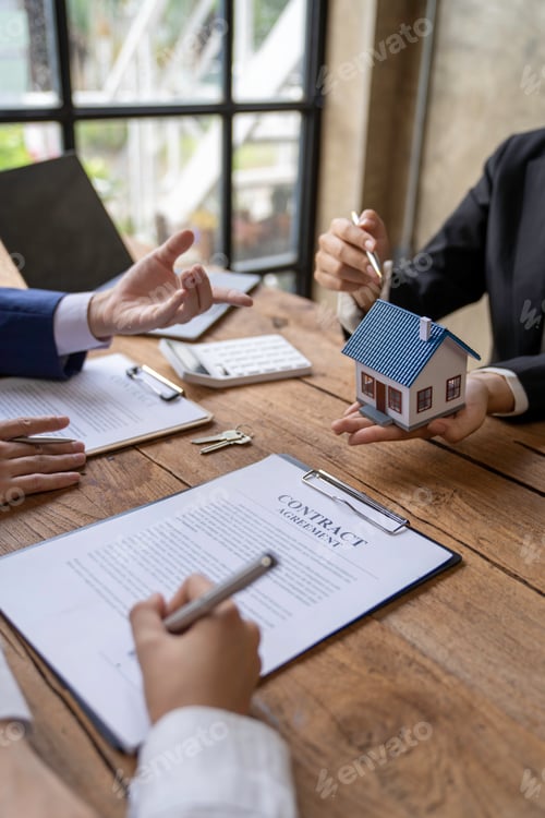 Preview: Real Estate Contract Signing On Wooden Desk