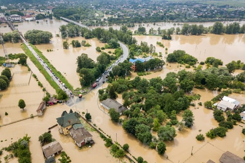 Preview: Aerial view of flooded houses with dirty water of Dnister river in Halych town, western Ukraine
