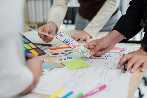 Preview: UI designer and UX developer brainstorm idea to design the application interface. Creative digital