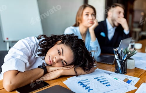 Preview: Depressed Lady Resting Head On Hands During Meeting In Office