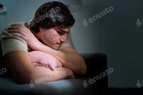 Preview: Young man feeling depression and anxiety at home