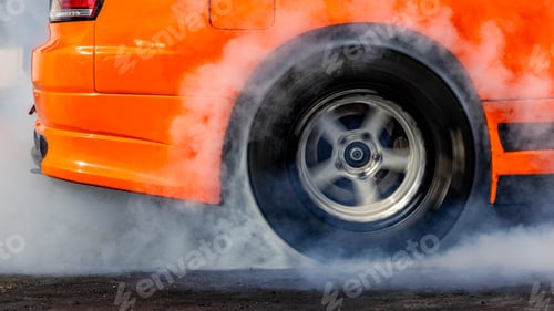 Preview: Car burnout wheels tire with white smoke,Car wheel burnout with smoke from the spinning tyre.