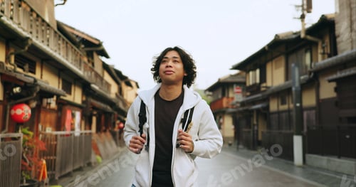 Preview: Man, Japan and travel or city street with backpack or adventure, vacation or cultural history. Asia