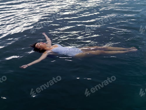 Preview: Serenity on the water as a woman effortlessly floats