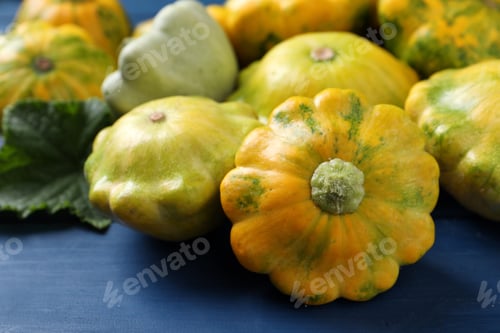 Preview: Fresh ripe pattypan squashes on blue wooden table, closeup