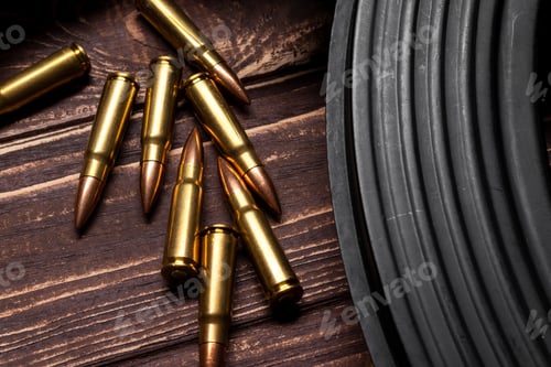Preview: Bullets and Kalashnikov assault rifle on wooden background