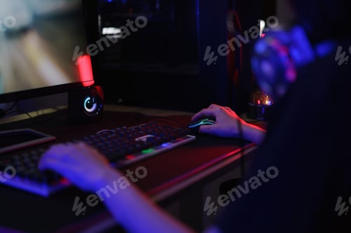 Preview: Female cyber hacker gamer using keyboard and mouse to playing games or hacking programming system