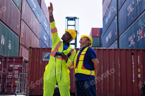 Preview: Engineer working in container storage yard fly drone looking top view check container arrangement