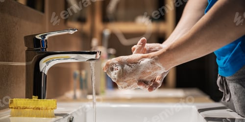Preview: Closeup view of woman washing her hands thoroughly