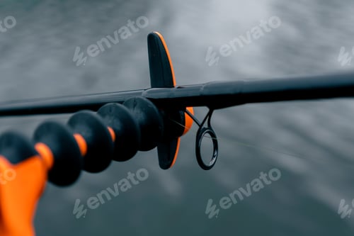 Preview: close-up spinning on background dark river water sports fishing hobby active recreation