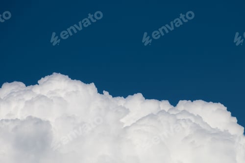 Preview: Amazing shot of a beautiful big cloud on blue sky background