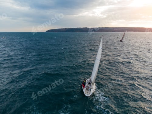 Preview: sailing yachts regatta race on sea aerial view