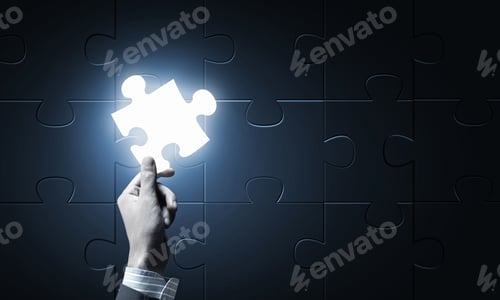Preview: Close Up Of Businessman Hand Holding Glowing Jigsaw Element