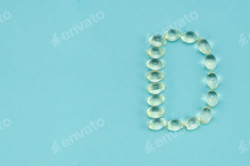 Vitamin D Capsules Forming the Letter D