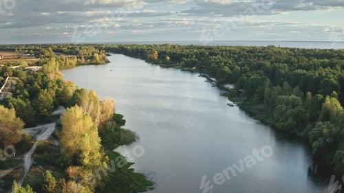 Preview: Green leaf forest at river aerial. Urban nobody nature landscape. Cityscape at autumn colorful trees