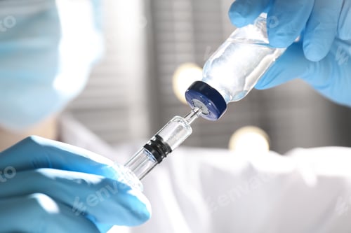 Preview: Woman filling syringe with vaccine from vial on blurred background, closeup