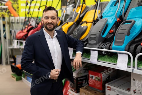 Preview: portrait of an entrepreneur selling electric and battery lawn mowers
