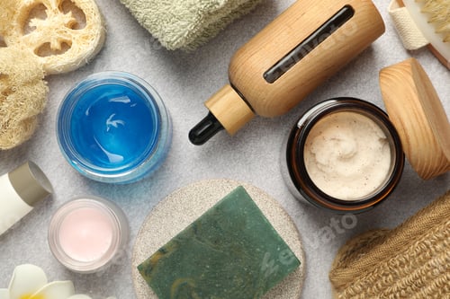 Preview: Different body care products on light grey table, flat lay
