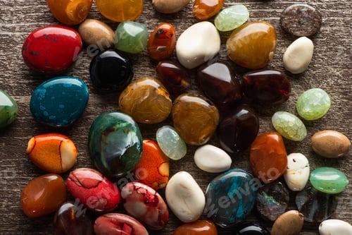 Preview: Top View of Colorful Fortune Telling Stones on Wooden Background