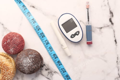 Preview: diabetic measurement tools, insulin and cookies on white