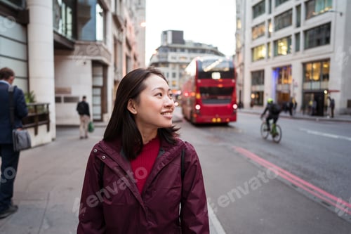 Preview: Cheerful Asia woman on city street