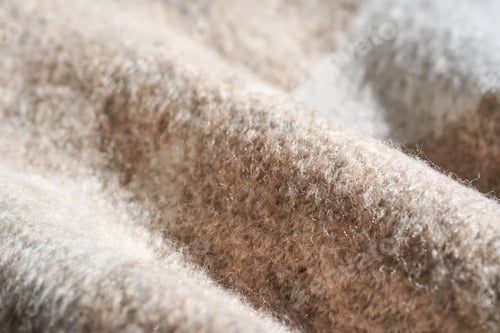 Preview: The texture of a warm sweater with a beige pattern.