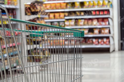 Preview: Closeup the trolley for shopping over the store blurred in department store bokeh background