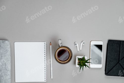 Preview: Top view of stationery and telephone, coffee on grey desktop background. Business concept