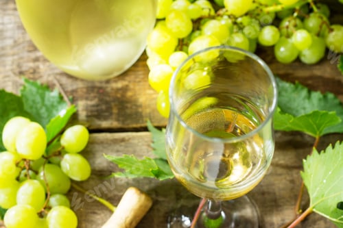 Preview: Wine background. White wine in glasses, bottle, grapes on vintage background, wine concept.