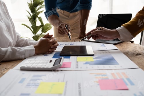 Preview: Cropped shot of smart and professional business team working together with chart and graph analysis