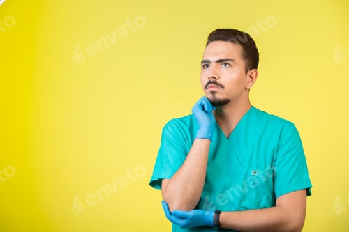Preview: Doctor in uniform and hand mask looking to nowhere and overthinking