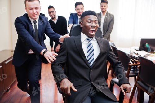 Preview: Multiracial young creative people in modern office