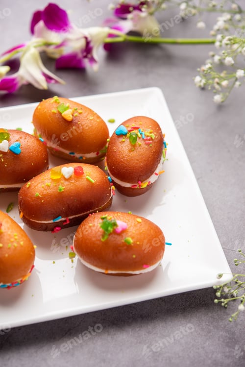 Preview: Malai Chop or Cream sandwich made using filling Rasgulla or Gulab jamun sweet is a Bengali sweet