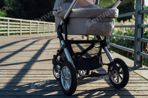 Preview: Baby stroller on running path in park