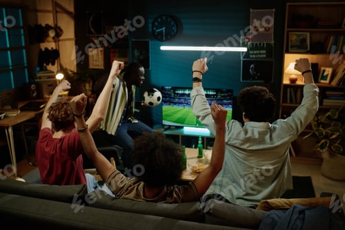 Preview: Friends Having Fun Watching Soccer Game On TV