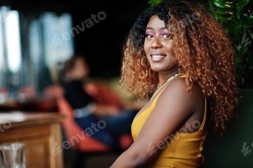 Preview: African american woman in yellow dress