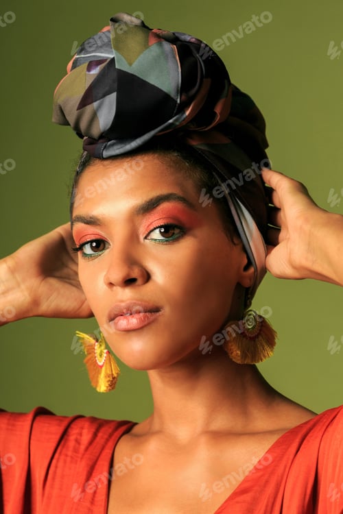 Preview: Beauty portrait ofStylish woman with colorful turban in studio.
