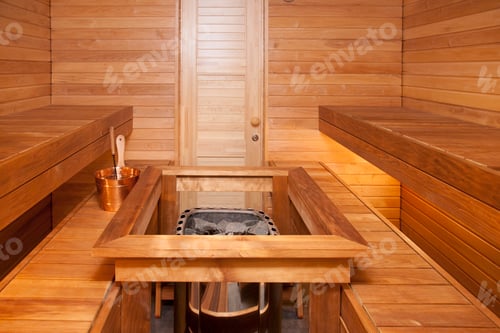 Preview: Interior of a wooden panelled steam room, sauna,with central stove or hot stone