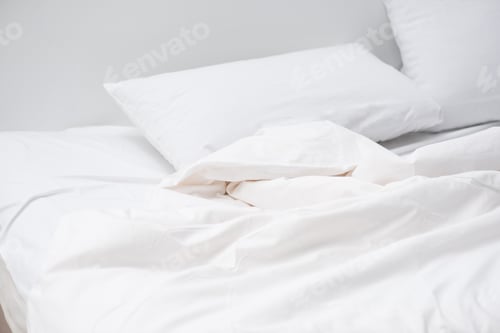 Preview: cozy bed with white pillows and blanket