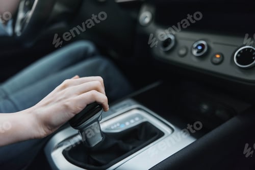 Preview: Car, driver, automatic gearbox, shift knob, steering wheel a person is driving a car, adjusting the