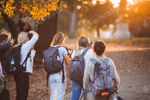 Preview: Group of photographer taking pictures of family on photography shooting workshop
