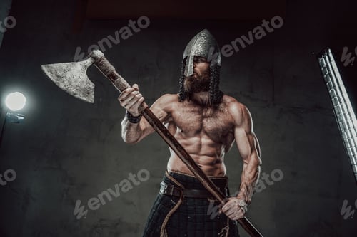 Preview: Viking with naked torso and beard posing in dark background