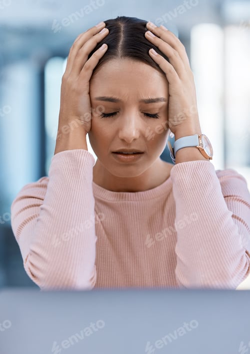 Preview: Stressed, tired and sick young woman with a headache feeling sad and overworked in an office. A fru